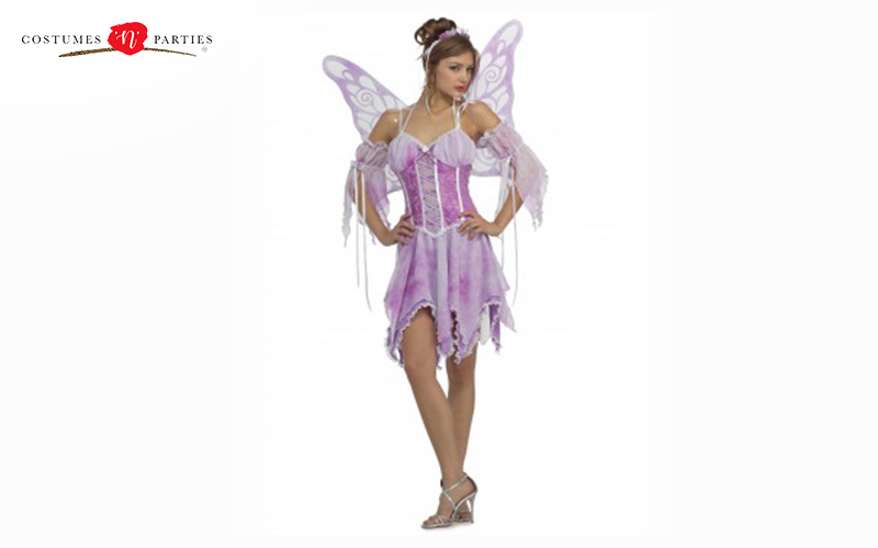 A woman in a pink fairy costume with wings.